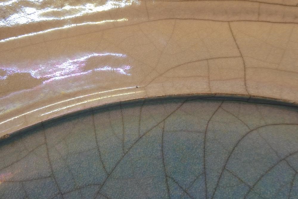 JOHN DUNN (b.1944) - a large Raku iridescent turquoise glazed stoneware circular dish, signed, 22" Image