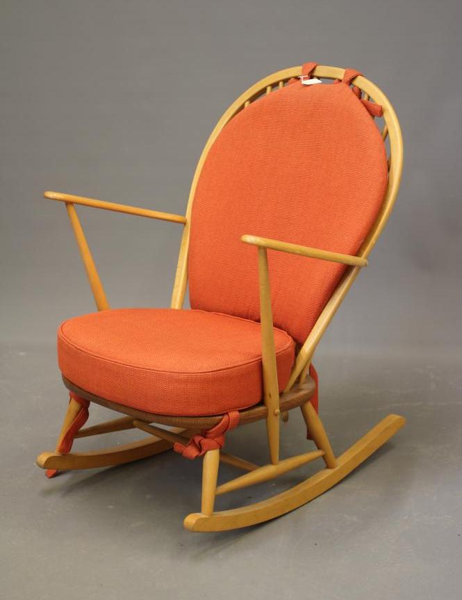 AN ERCOL MODEL 316 ROCKING CHAIR, mid 20th century, in blond beech and elm, with loose cushions in Image