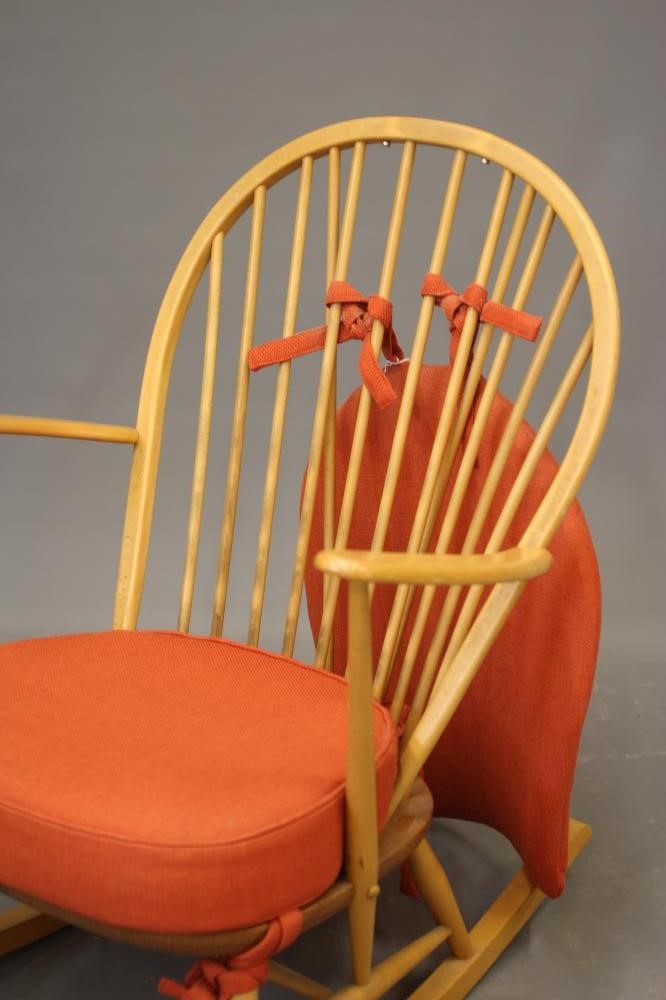 AN ERCOL MODEL 316 ROCKING CHAIR, mid 20th century, in blond beech and elm, with loose cushions in Image