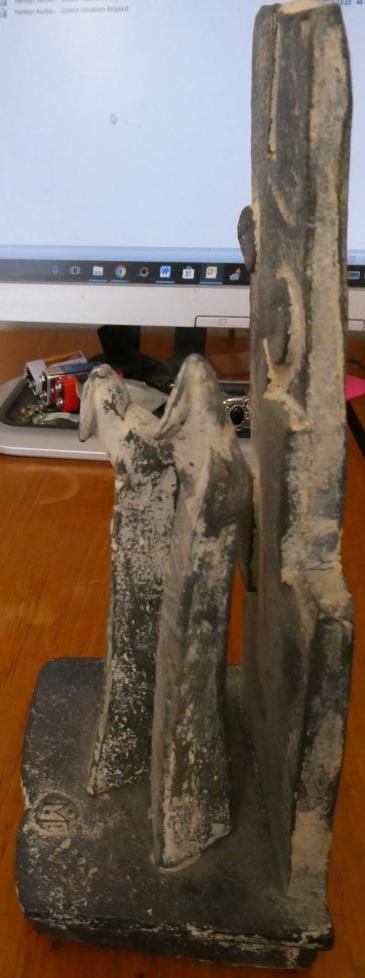 JOHN MALTBY (1936-2000) - a matt grey stoneware sculpture of two figures standing before a cut slab Image