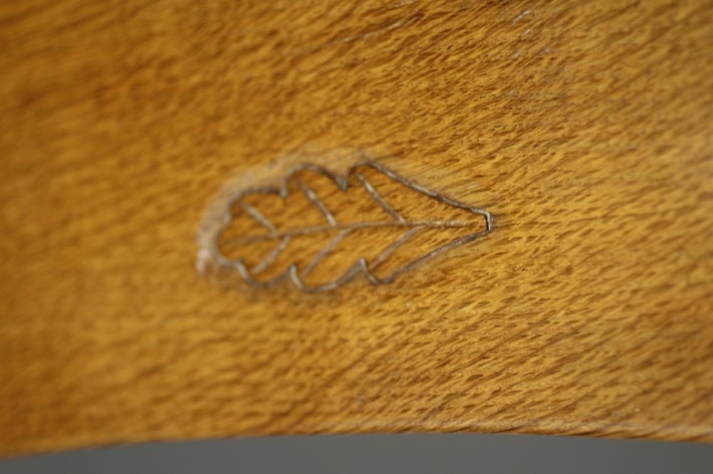 DAVID LANGSTAFF, AN ADZED OAK COFFEE TABLE, the concave sided octagonal top on waisted cruciform Image