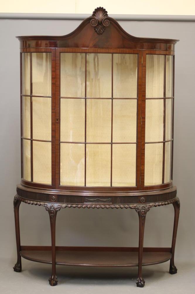 A MAHOGANY DISPLAY CABINET of bowed form Image