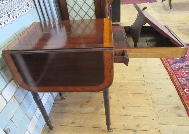 A LADY'S REGENCY MAHOGANY DROP LEAF SMALL WRITING TABLE Image