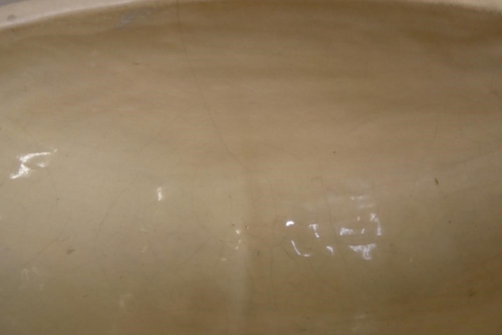 CONSTANCE SPRY (1886-1960) / CHARLES WEST for Fulham Pottery - an unglazed buff earthenware oval Image