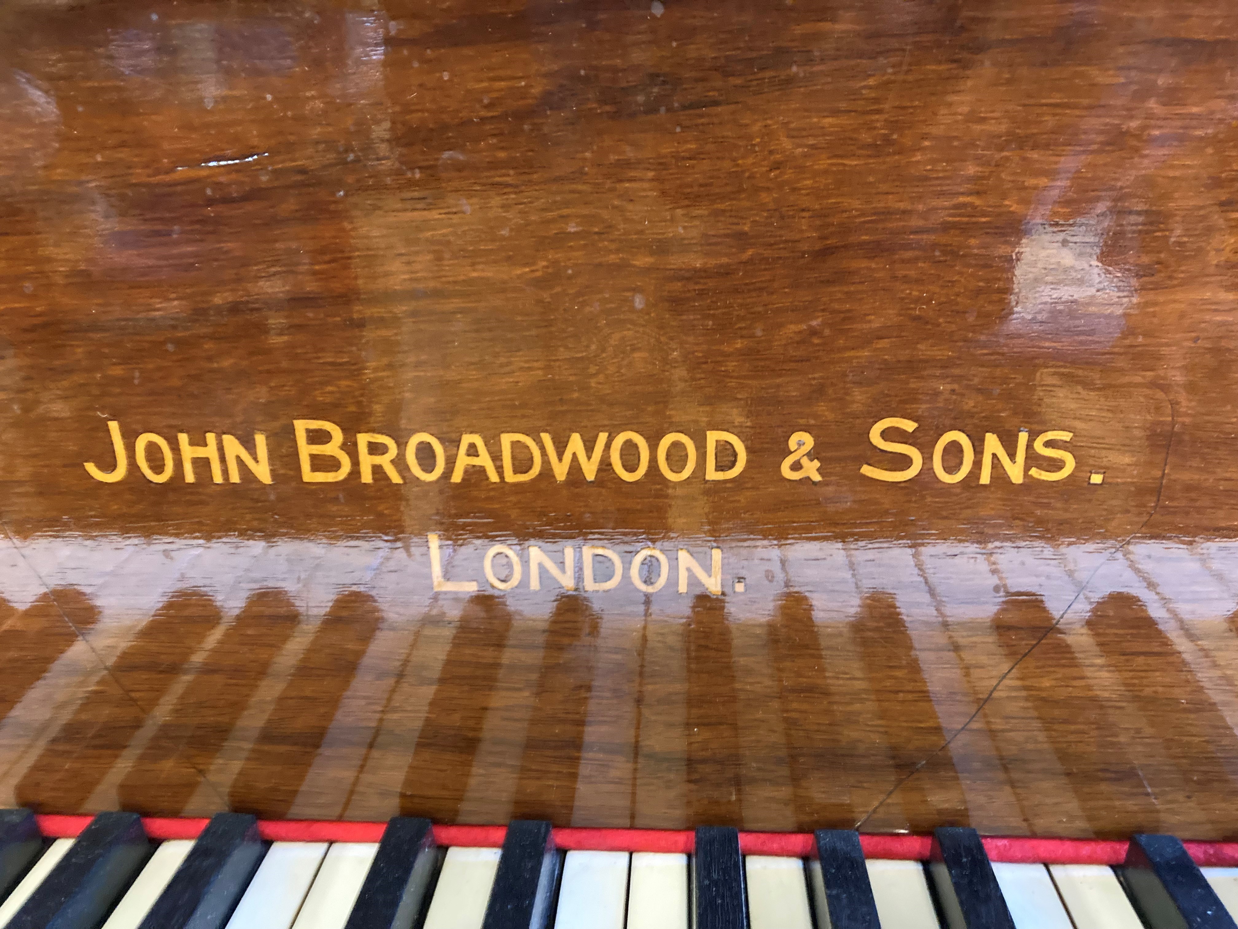 A JOHN BROADWOOD & SONS BABY GRAND PIANO in mahogany case with Chinese fret music stand Image
