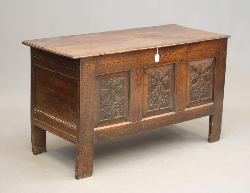 AN OAK PANELLED COFFER Image