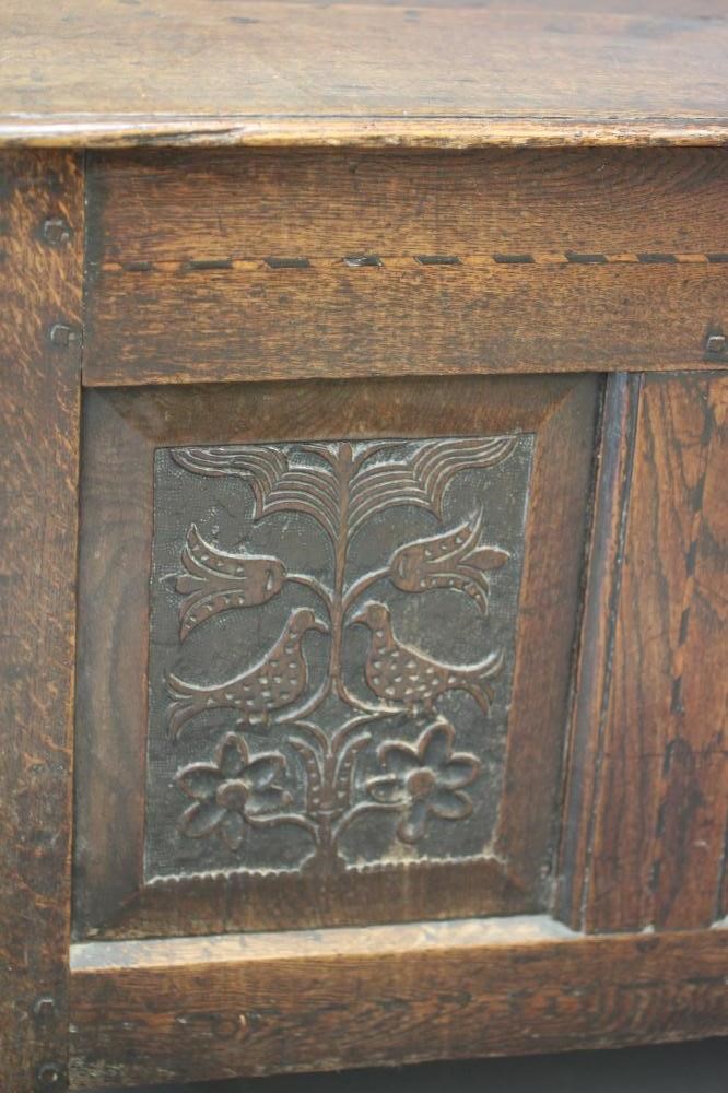 AN OAK PANELLED COFFER Image