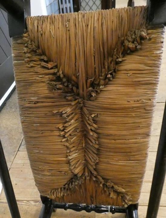 AN ARTS AND CRAFTS EBONISED RUSH SEATED STOOL Image