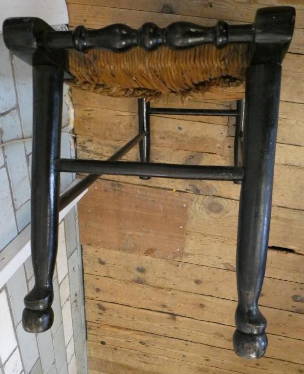 AN ARTS AND CRAFTS EBONISED RUSH SEATED STOOL Image