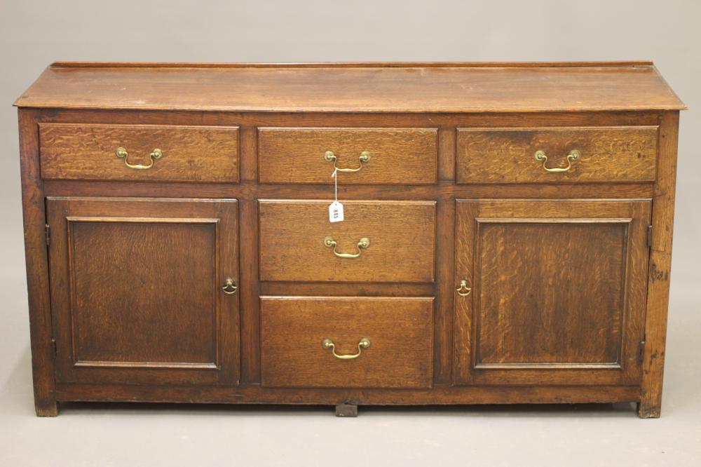 AN OAK ENCLOSED DRESSER Image