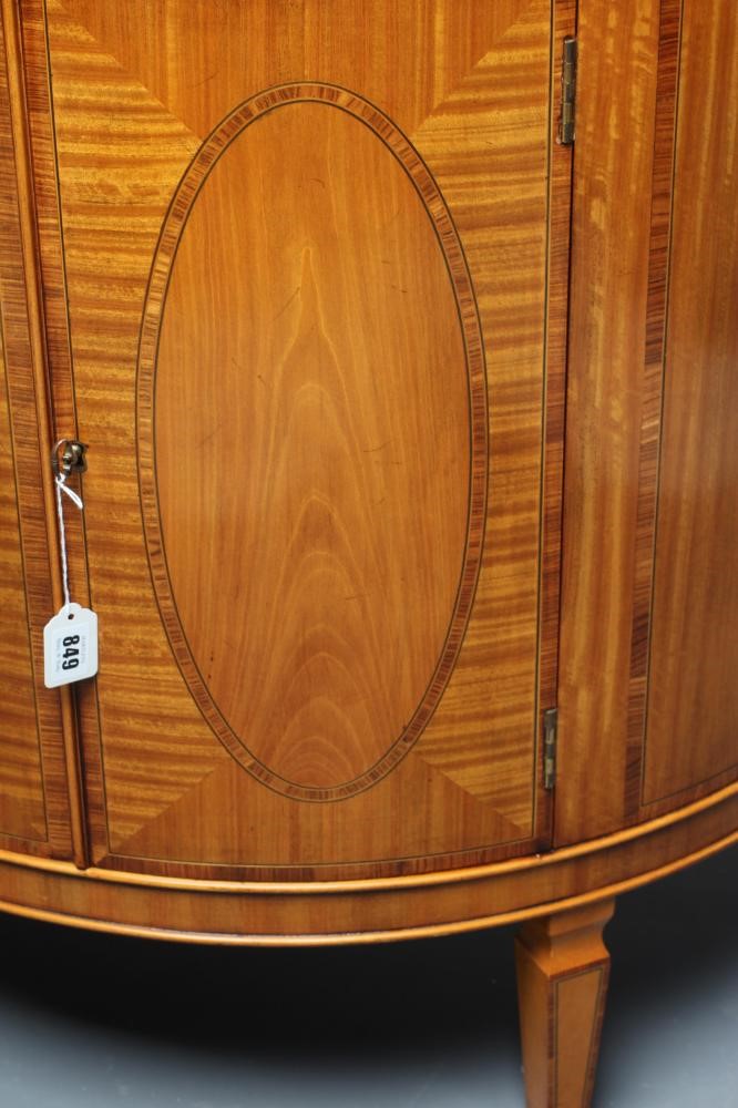 A SATINWOOD COMMODE Image