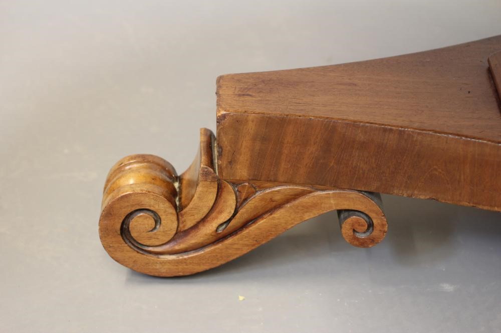 A VICTORIAN MAHOGANY CENTRE TABLE, the moulded edged circular tilt top on triangular stem concave Image