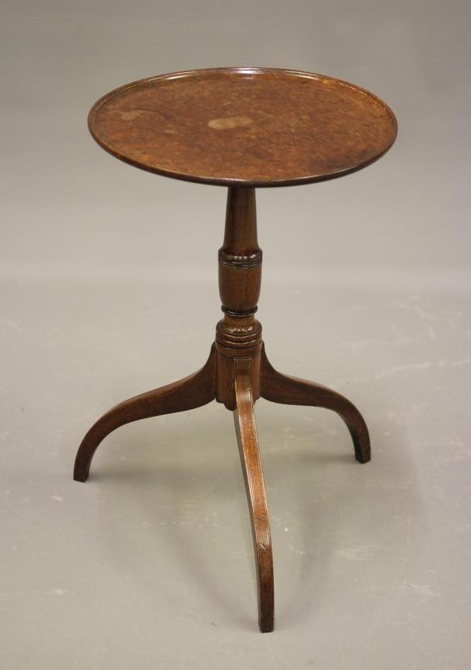 A GEORGIAN MAHOGANY WINE TABLE, c.1800, the dished circular top on turned vase stem, raised on Image