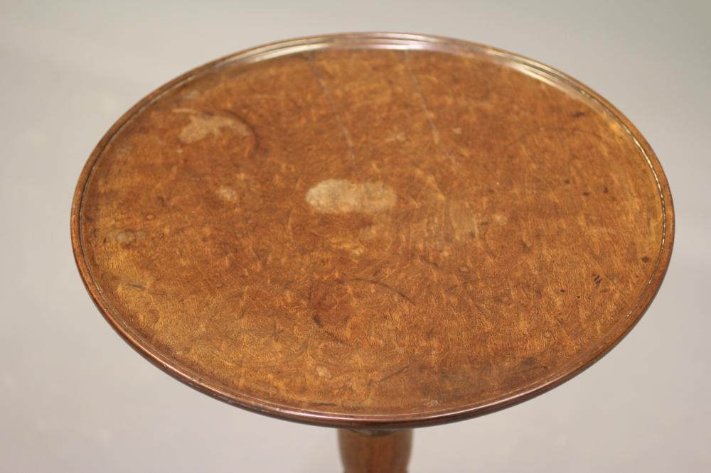 A GEORGIAN MAHOGANY WINE TABLE, c.1800, the dished circular top on turned vase stem, raised on Image