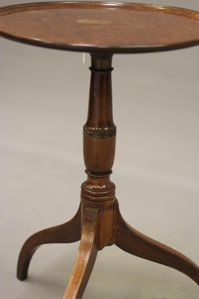 A GEORGIAN MAHOGANY WINE TABLE, c.1800, the dished circular top on turned vase stem, raised on Image