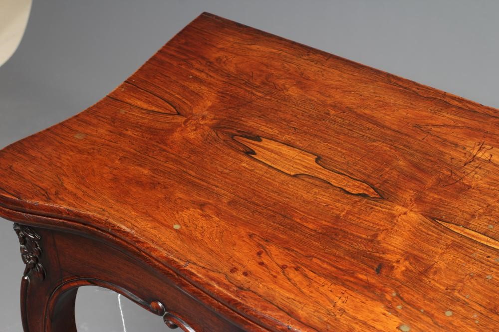A VICTORIAN ROSEWOOD FOLDING CARD TABLE of serpentine oblong form Image