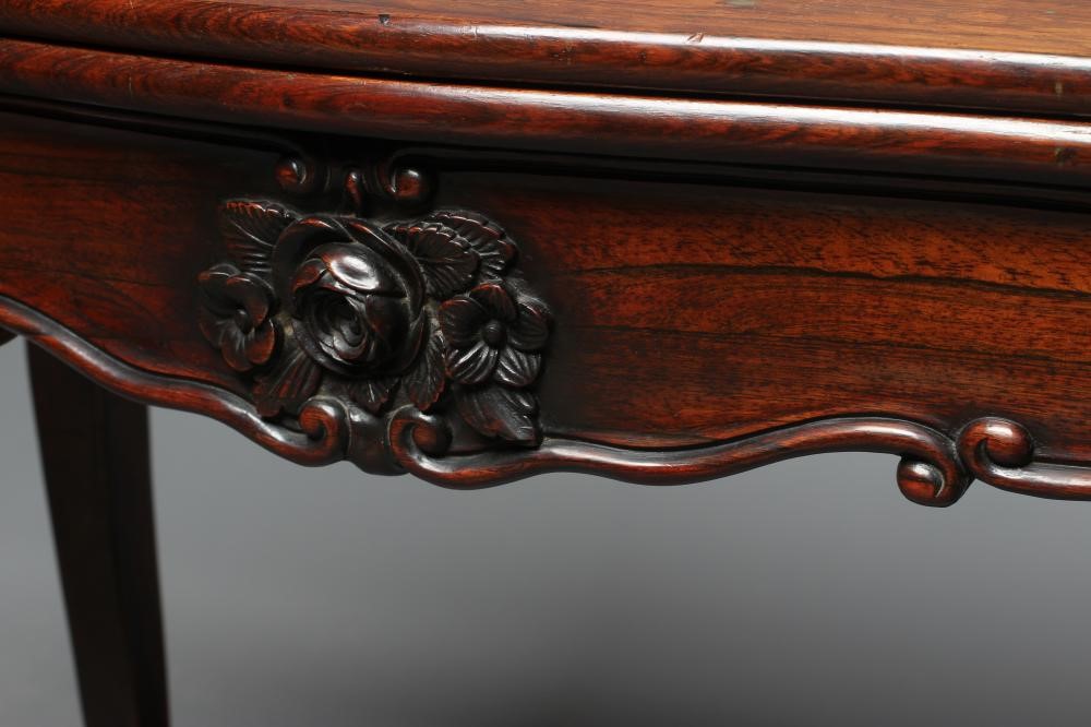 A VICTORIAN ROSEWOOD FOLDING CARD TABLE of serpentine oblong form Image