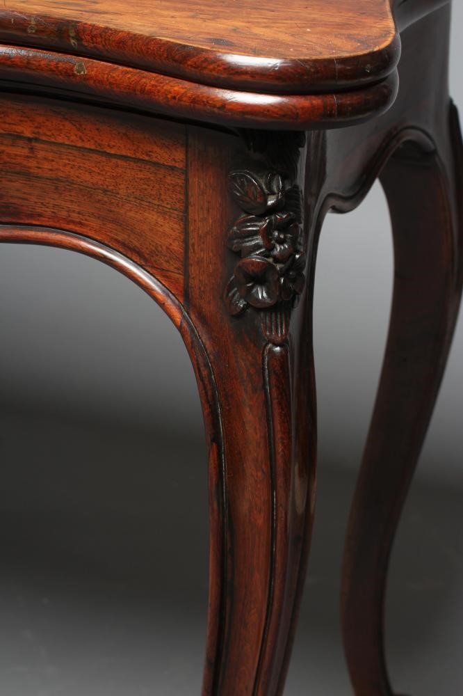 A VICTORIAN ROSEWOOD FOLDING CARD TABLE of serpentine oblong form Image