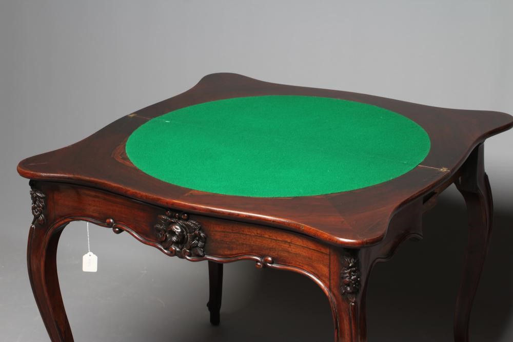 A VICTORIAN ROSEWOOD FOLDING CARD TABLE of serpentine oblong form Image
