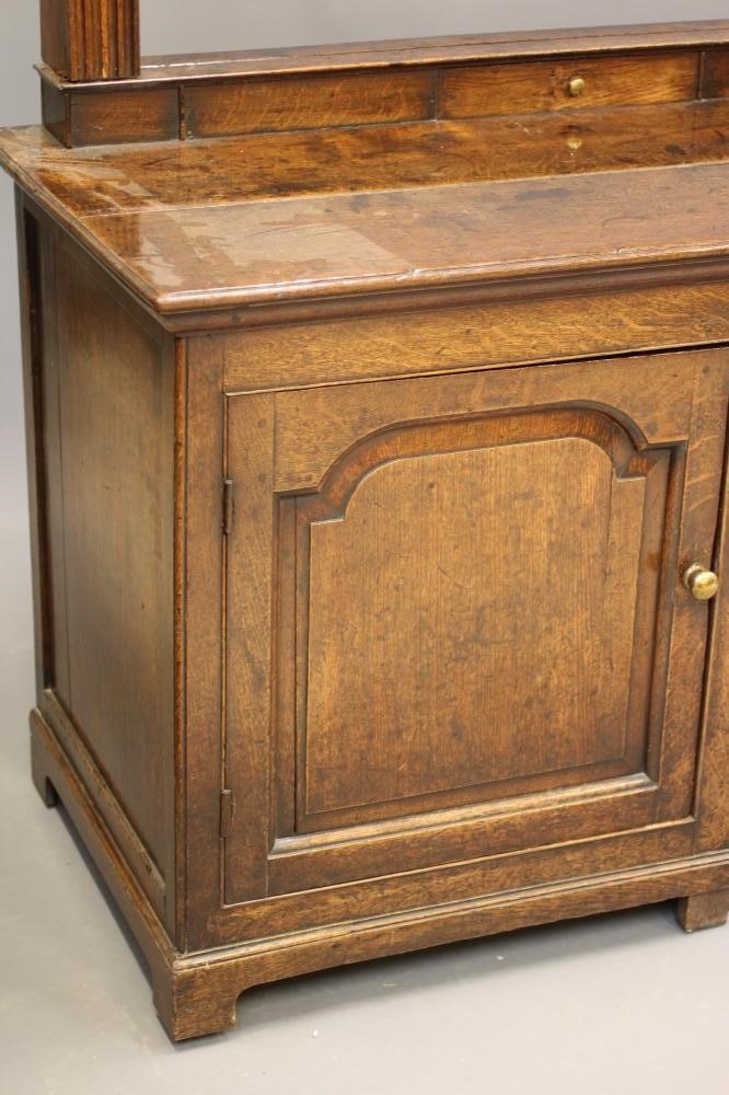 A GEORGIAN OAK ENCLOSED DRESSER Image
