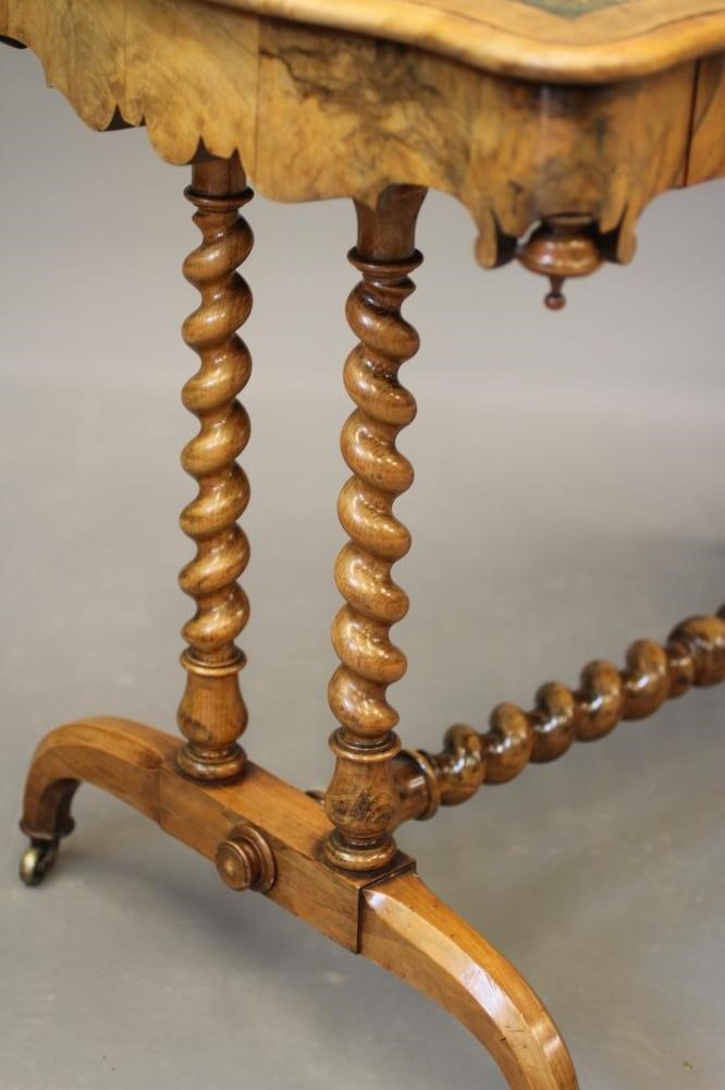 A VICTORIAN WALNUT LIBRARY TABLE Image