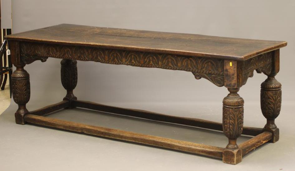 A JOINED OAK DINING TABLE Image