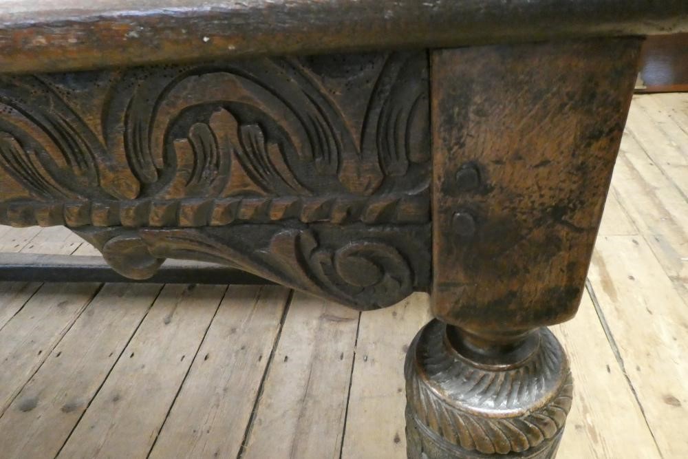 A JOINED OAK DINING TABLE Image