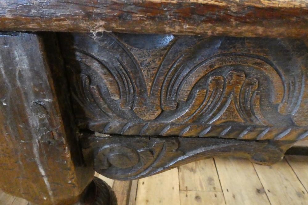 A JOINED OAK DINING TABLE Image