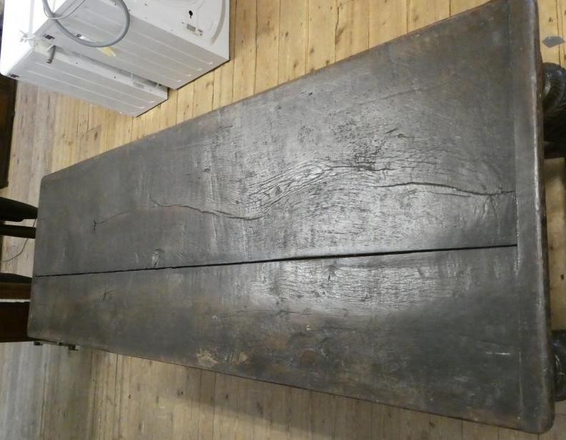 A JOINED OAK DINING TABLE Image