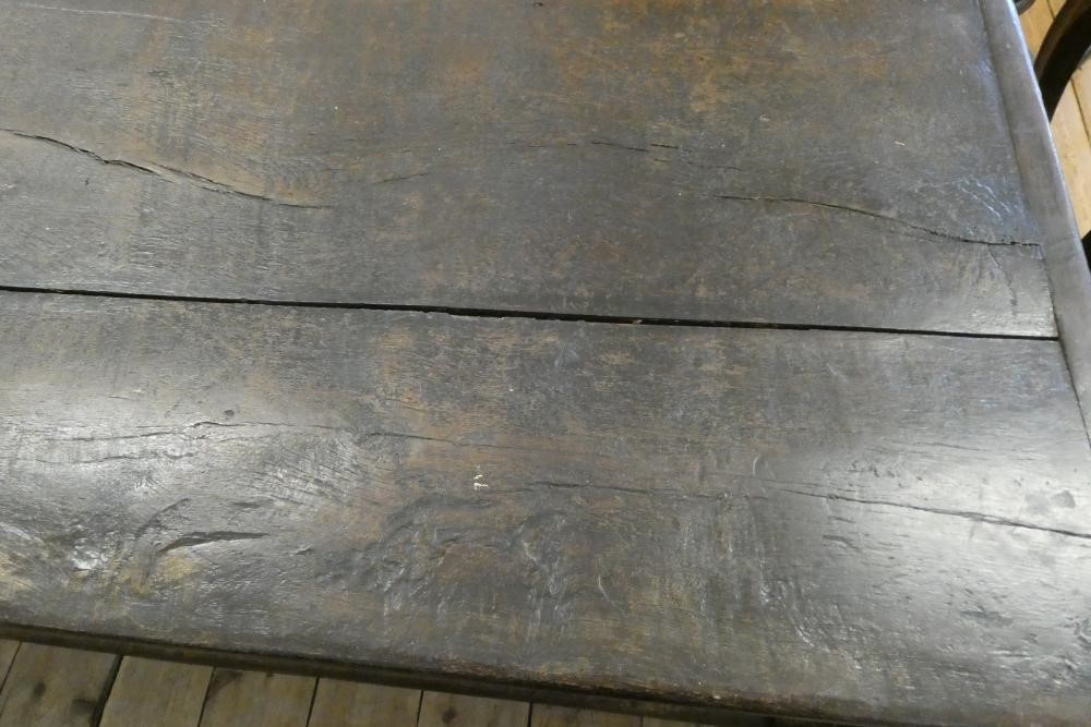 A JOINED OAK DINING TABLE Image