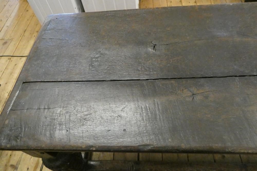 A JOINED OAK DINING TABLE Image