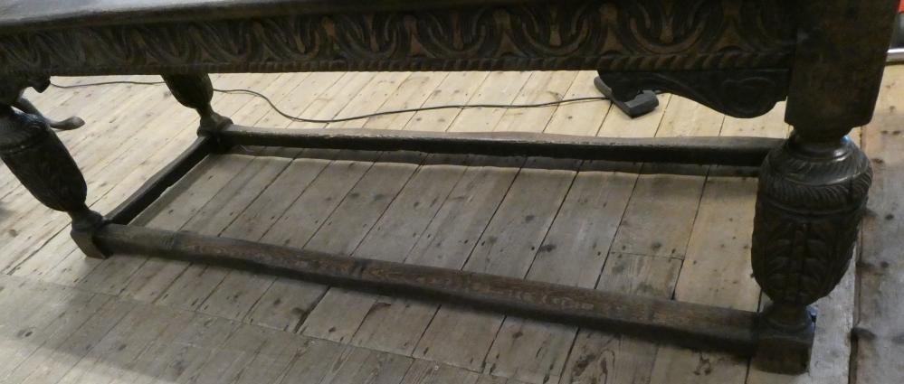 A JOINED OAK DINING TABLE Image