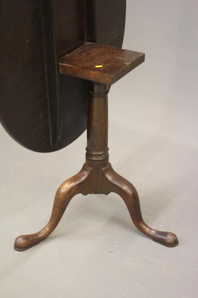 A GEORGIAN MAHOGANY TRIPOD TABLE, third quarter 18th century, the circular tilt top on turned gun Image