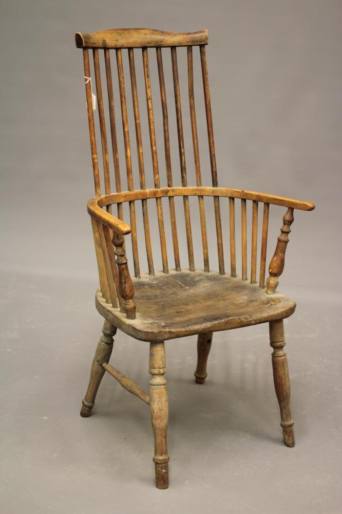 A COMB BACK WINDSOR ARMCHAIR Image