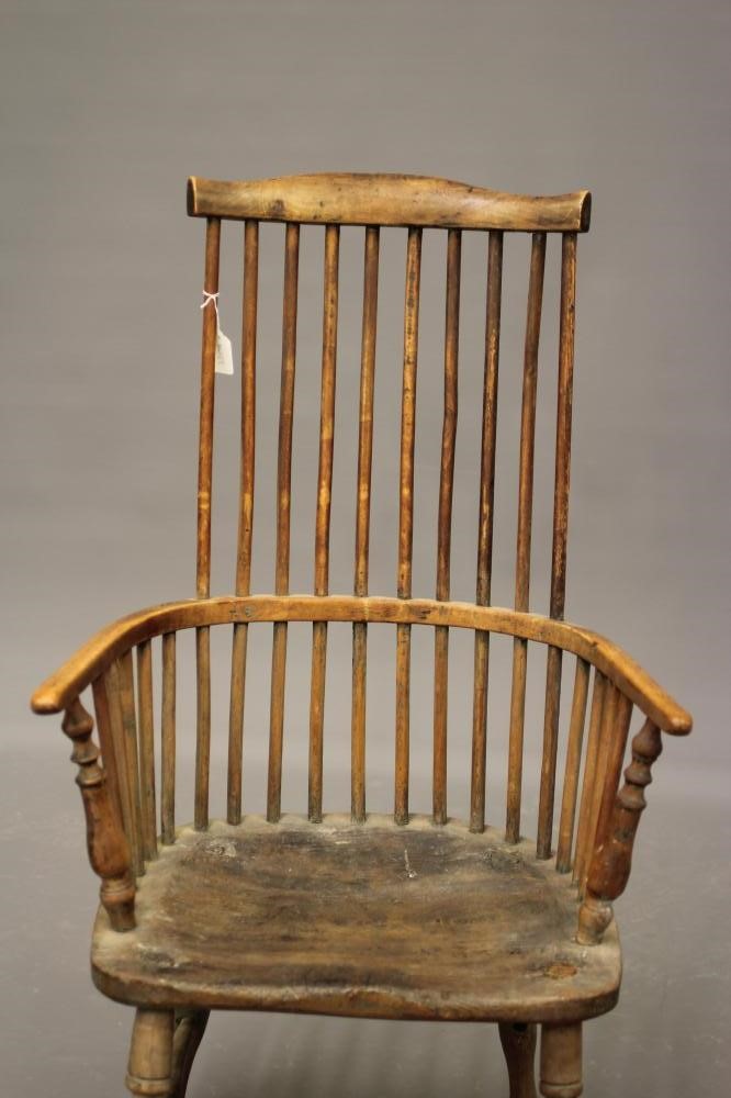 A COMB BACK WINDSOR ARMCHAIR Image