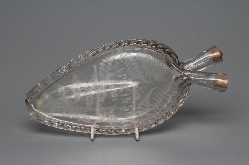 A VICTORIAN ELIPTICAL GLASS FLASK with double spout and applied prunted edge Image
