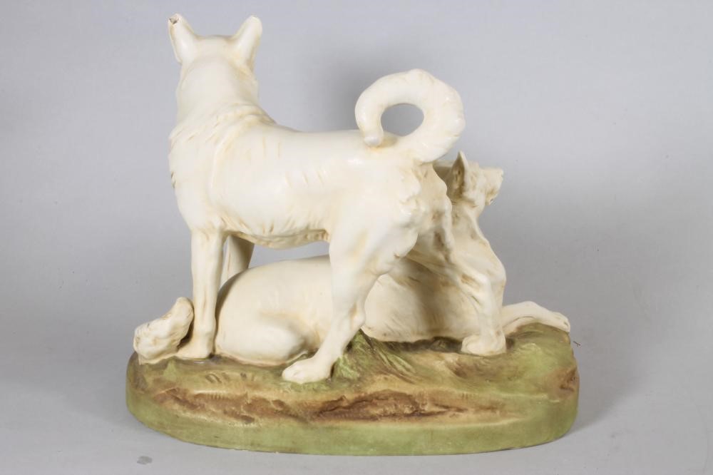 A ROYAL DUX PORCELAIN DOG GROUP modelled as two Japanese Hokkaido recumbent and standing Image