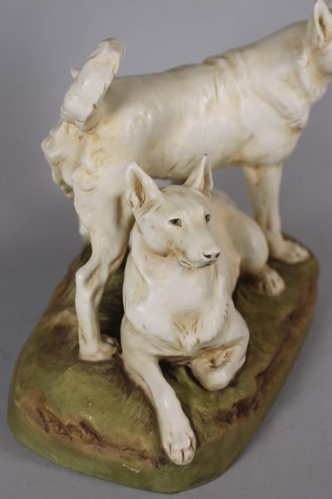 A ROYAL DUX PORCELAIN DOG GROUP modelled as two Japanese Hokkaido recumbent and standing Image