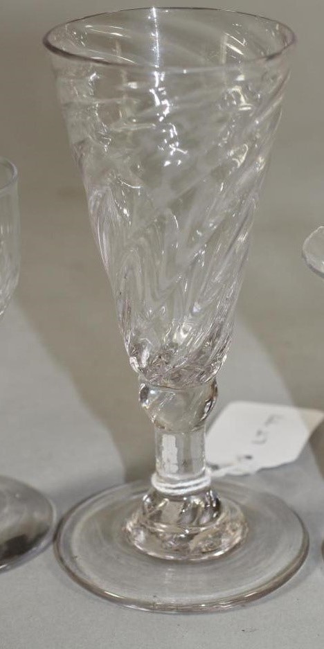 A COLLECTION OF FOUR GEORGIAN AND SLIGHTLY LATER DRINKING GLASSES comprising a panel moulded jelly Image