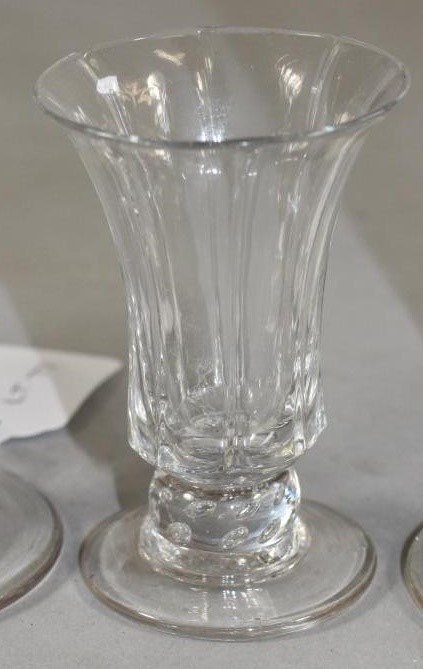 A COLLECTION OF FOUR GEORGIAN AND SLIGHTLY LATER DRINKING GLASSES comprising a panel moulded jelly Image