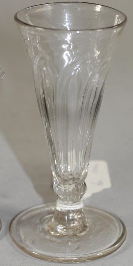 A COLLECTION OF FOUR GEORGIAN AND SLIGHTLY LATER DRINKING GLASSES comprising a panel moulded jelly Image