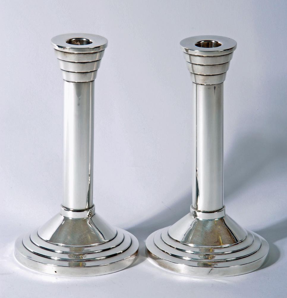 A PAIR OF SILVER CANDLESTICKS Image