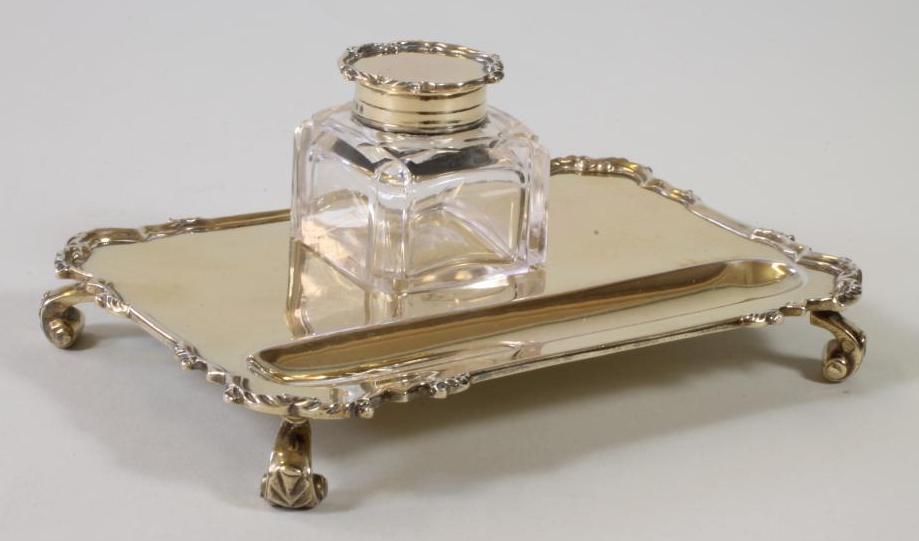 A SMALL SILVER GILT DESK STAND Image