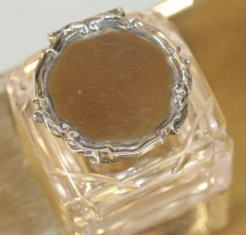 A SMALL SILVER GILT DESK STAND Image