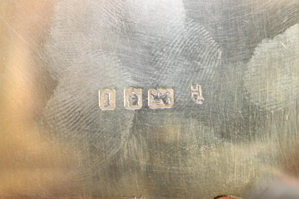 A SMALL SILVER GILT DESK STAND Image