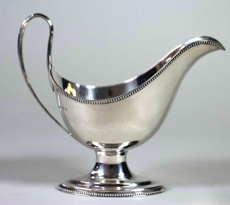 A SILVER PEDESTAL SAUCEBOAT Image