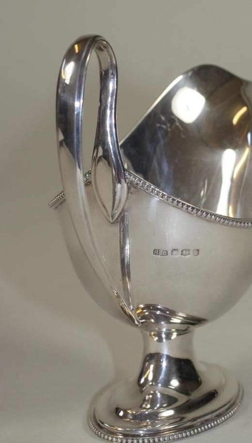 A SILVER PEDESTAL SAUCEBOAT Image