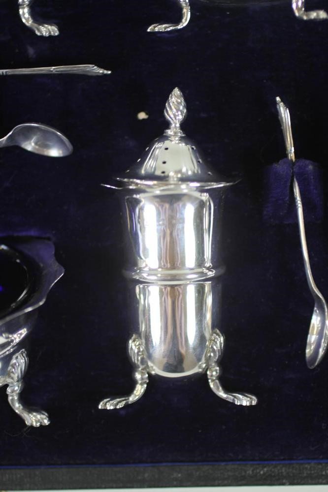 AN EDWARDIAN SILVER SEVEN PIECE CRUET Image