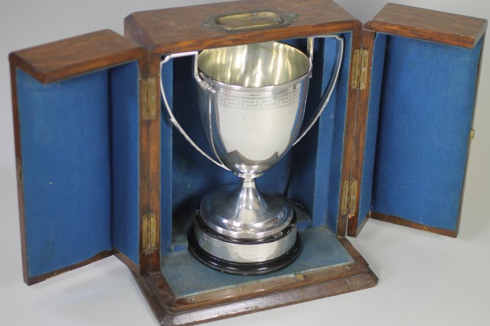*A LATE GEORGE III SILVER TROPHY CUP Image