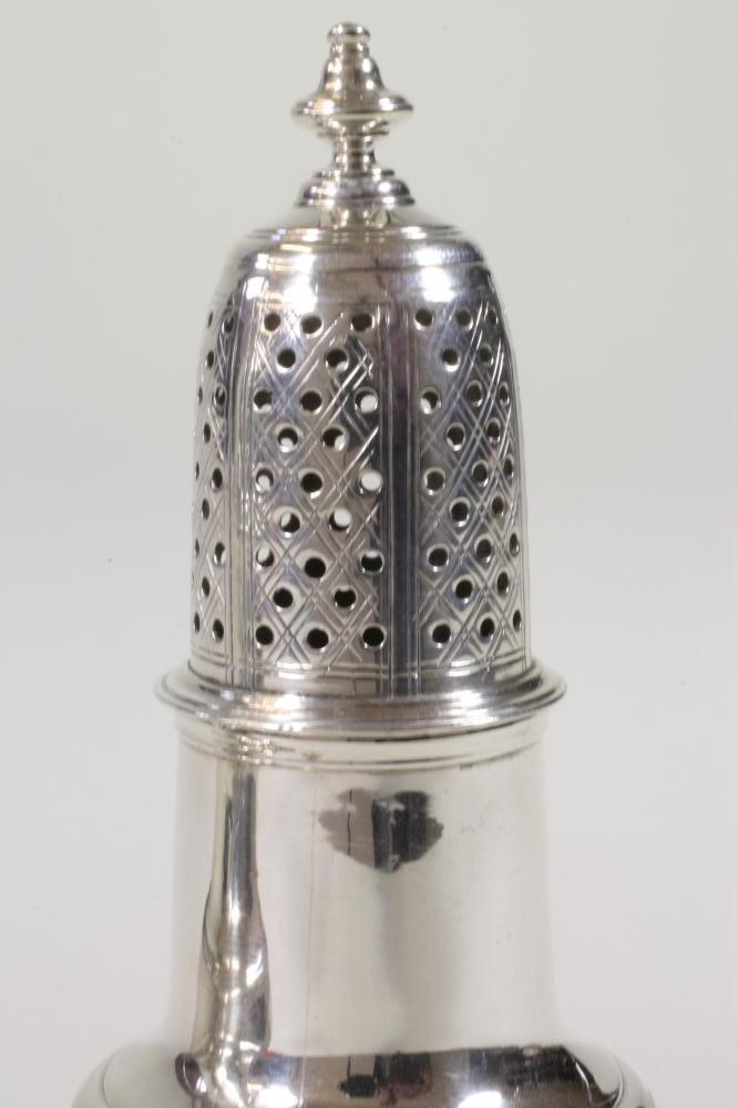 AN EARLY GEORGE II SILVER VASE SHAPED PEPPERETTE Image